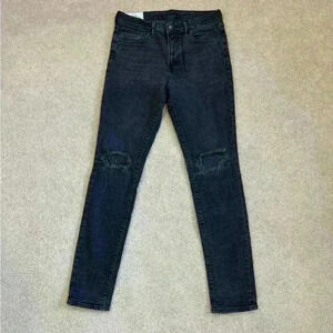 H&M black distressed skinny jeans in size 32